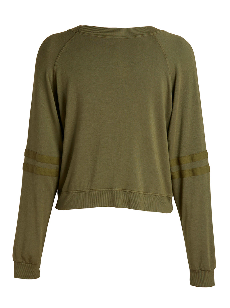 LVHR Sabina Crop Raglan in olive. Micro modal french terry sweatshirt with lightly distressed rib cuff and hem and side slits. Slightly cropped with stripe sleeve detail. Back.