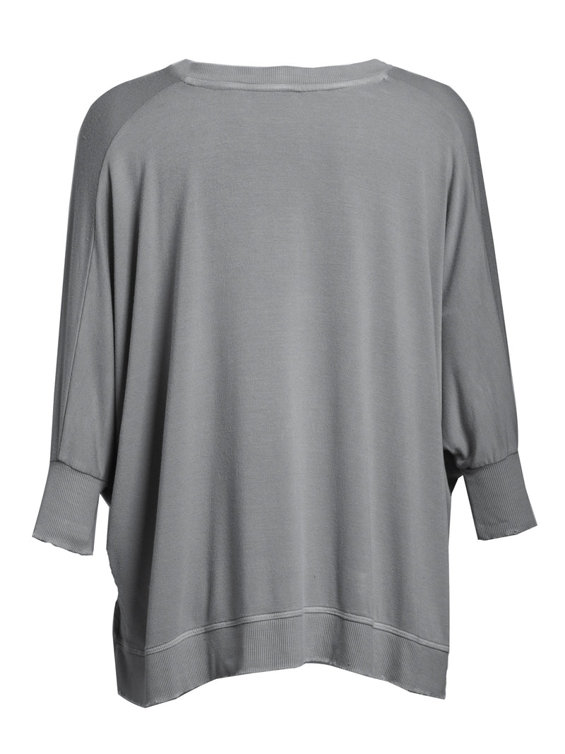 LVHR Sabina V Neck in slate grey. Micro modal french terry domain 3/4 sleeve top with slightly distressed rib cuff and hem and side slits. Back.