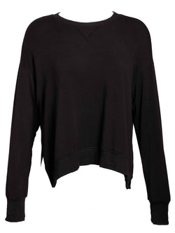 LVHR Sabina Crew in black. Micro modal french terry sweatshirt with slightly distressed rib cuff and hem and side slits. Front.
