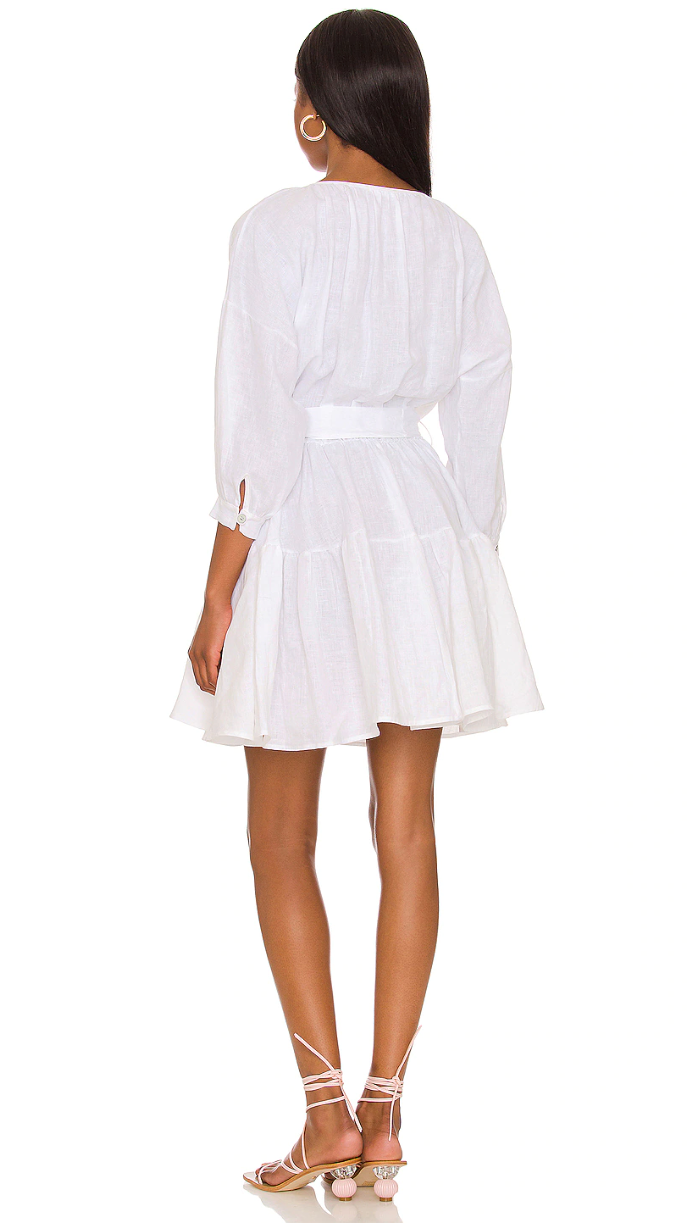 LVHR Stevie Dress in white. Washed linen dress with elastic waist, sash tie, ruffled skirt hem and cuffed sleeves. Back.