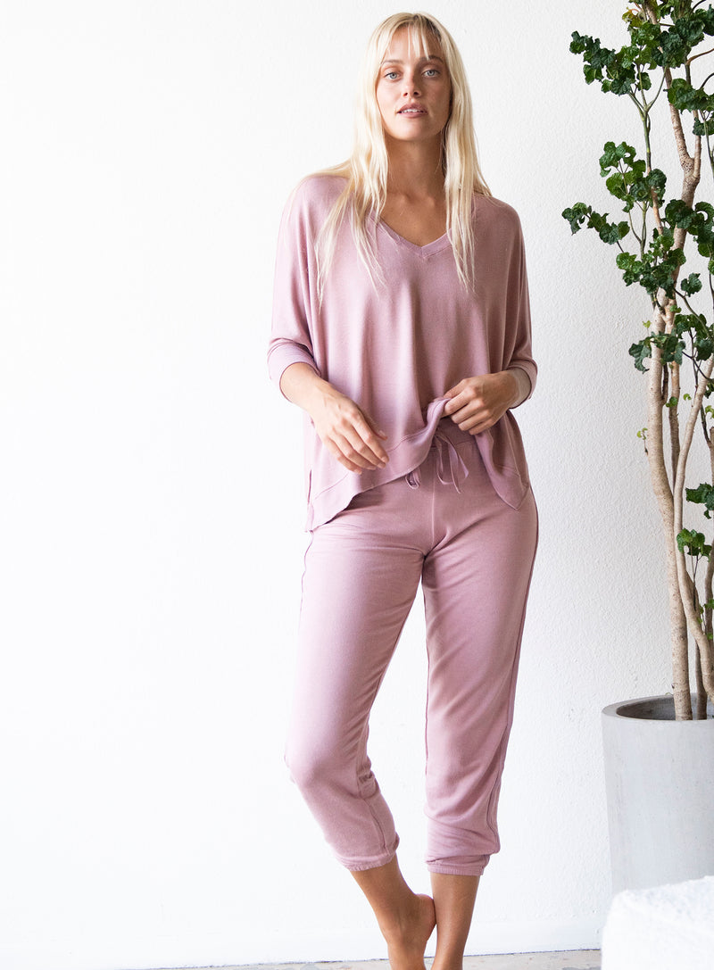 LVHR Sabina Crop Pant in vintage rose. Micro modal french terry pant. Slightly cropped length with cotton twill tape side detailing, Adjustable drawstring and elastic waistband. Relaxed fit. Styled with the Sabina Crew. Front.