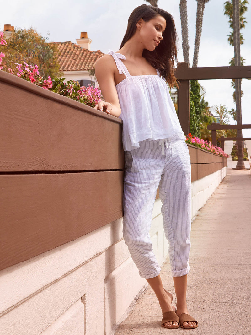 LVHR Taylor Crop Pant in white and navy pinstripe. Washed linen slightly cropped pant with front pockets and adjustable drawstring waistband. Styled with the Carly Top.